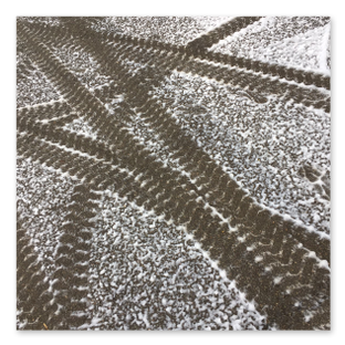 Snow - tyre tracks in settled foam snow
